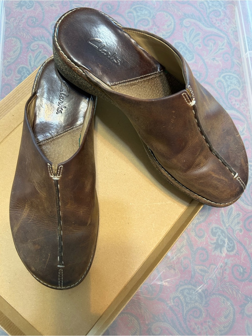 Clarks Woman’s  Brown Leather Slip-On clogs.  
Size 7